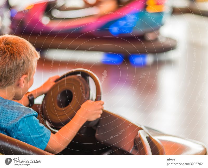 Boy drives a bumper car Leisure and hobbies Playing Vacation & Travel Trip Adventure Freedom Bumper car Night life Entertainment electronics Boy (child) 1