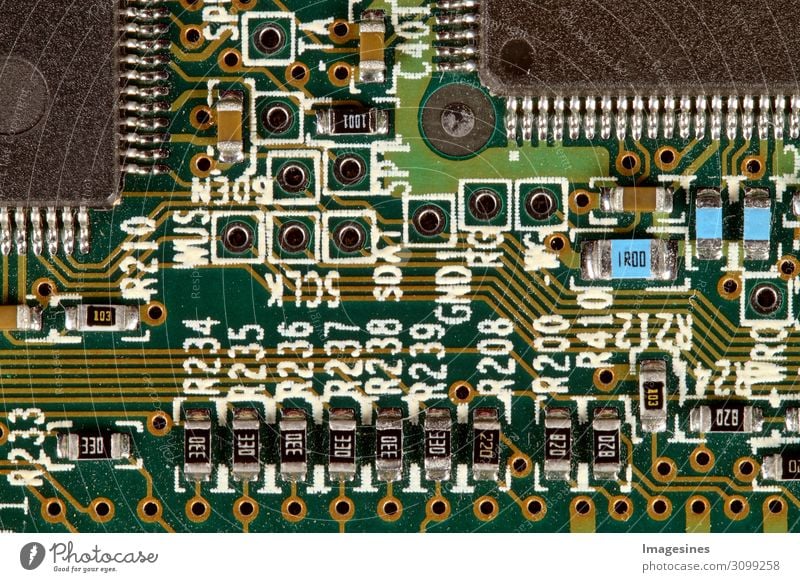 Computer motherboard with electronic components. Circuit board, printed circuit board, magnets. Information engineering. Old electronic computer hardware technology.
