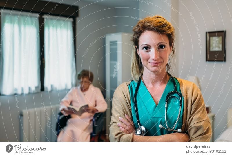 Pretty female doctor in a geriatric clinic with elderly woman in wheelchair Beautiful Health care Illness Relaxation Reading Bedroom Doctor Hospital Human being