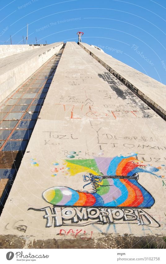 Pyramid of Tirana with graffiti against homophobia Homosexual Graffiti Concrete Albania Enver Hoxha Balkans LGBT LGBTQ LGBTQ+ Freedom Perspective Sky Pride