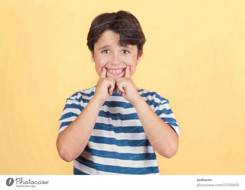Funny child making smile on yellow background Lifestyle Joy Medical treatment Playing Human being Masculine Child Infancy Mouth Teeth 1 3 - 8 years Fitness