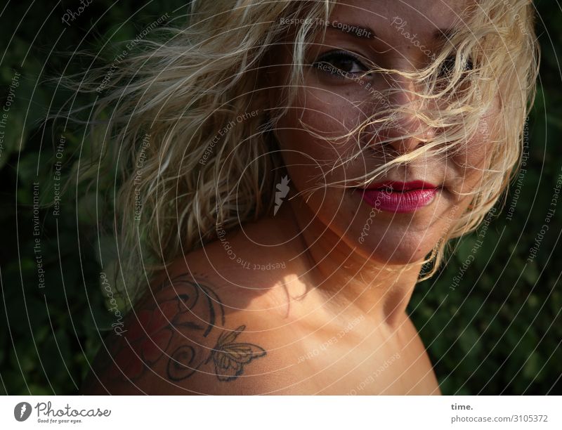 Woman with tattoo Feminine Adults 1 Human being Summer Beautiful weather Wind Park Tattoo Blonde Long-haired Curl Observe Looking Wait pretty Wild Emotions