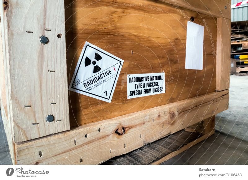 Radiation label beside the transport wooden box Industry Logistics Transport Package Strongbox Wood Sign Characters Signs and labeling Signage Warning sign