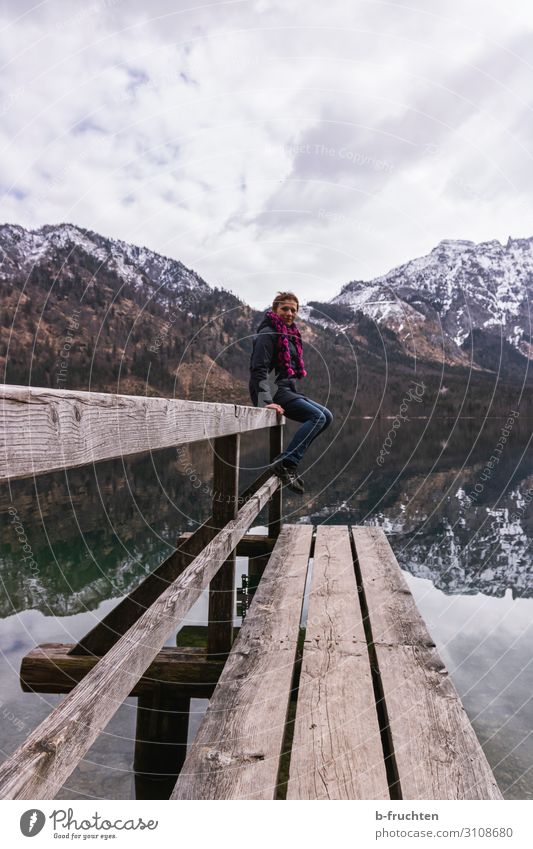 Woman on a wooden walkway Leisure and hobbies Winter Mountain Hiking Adults 1 Human being Clouds Spring Alps Lake Movement Sit Natural almsee Austria Reflection