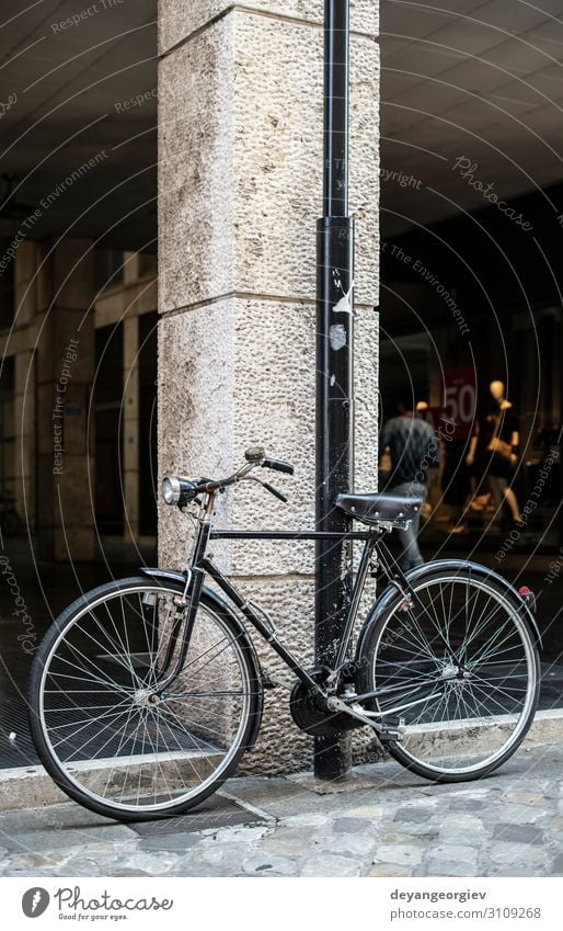 Black bike in front of fashion shop Lifestyle Shopping Style Vacation & Travel Tourism Decoration Art Town Architecture Transport Street Metal Rust Old Retro