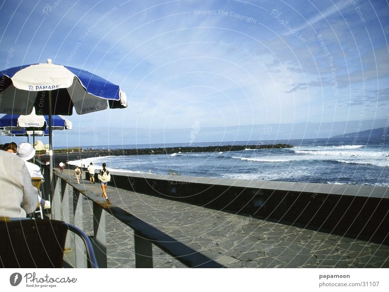 wild waves Ocean Beach Terrace Sunshade Clouds Waves Surf Far-off places Europe Bay Water Vantage point Blue