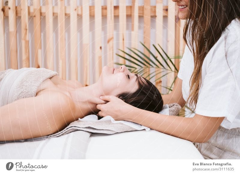 young Physiotherapist Woman giving a neck massage to patient Lifestyle Beautiful Body Healthy Health care Medical treatment Alternative medicine Illness