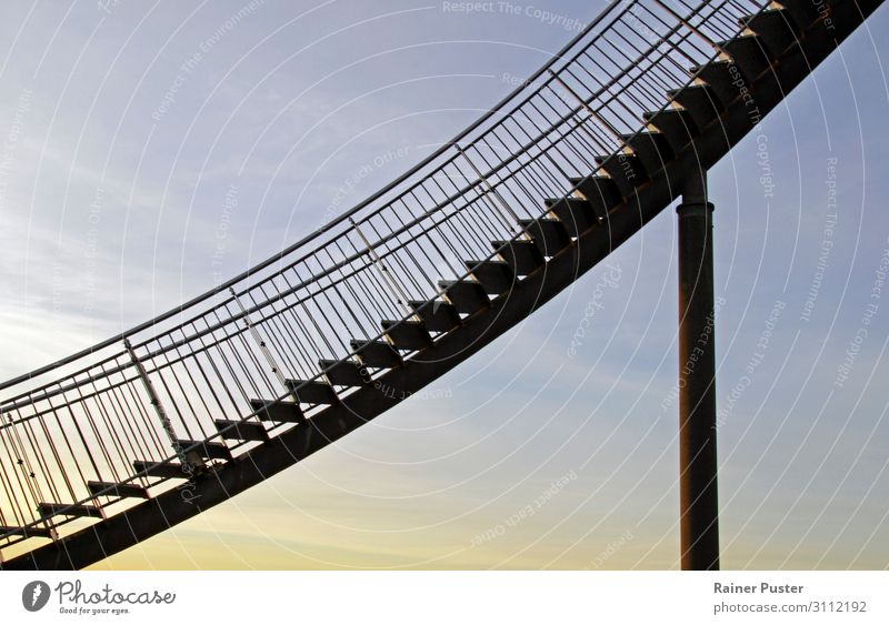 An ascending steel staircase in front of an evening sky Career Success Stairs Go up Blue Yellow Gold Level Rising Colour photo Exterior shot Copy Space left