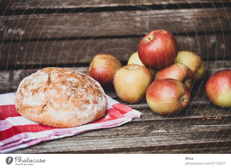 loaf of bread and crunchy apples on a wooden bench Food Apple Dough Baked goods Nutrition Picnic Organic produce Fresh Healthy Organic farming Delicious Bread
