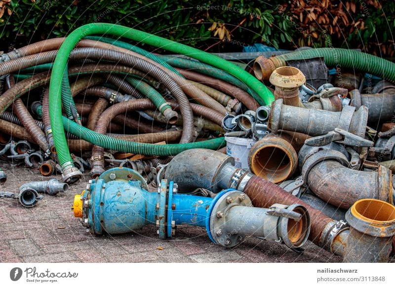 hoses Craftsperson Construction site Industry Technology Hose Conduit Pipe Metal Plastic Old Dirty Dark Simple Broken Blue Multicoloured Green Power