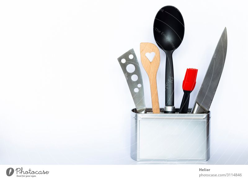 https://www.photocase.com/photos/3114846-cooking-utensils-in-a-metal-can-knives-spoon-photocase-stock-photo-large.jpeg