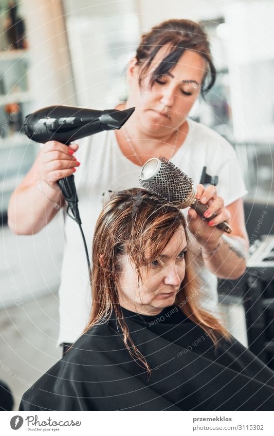 Hairdresser styling womans hair Lifestyle Style Beautiful Hair and hairstyles Work and employment Profession Scissors Brush Human being Young woman