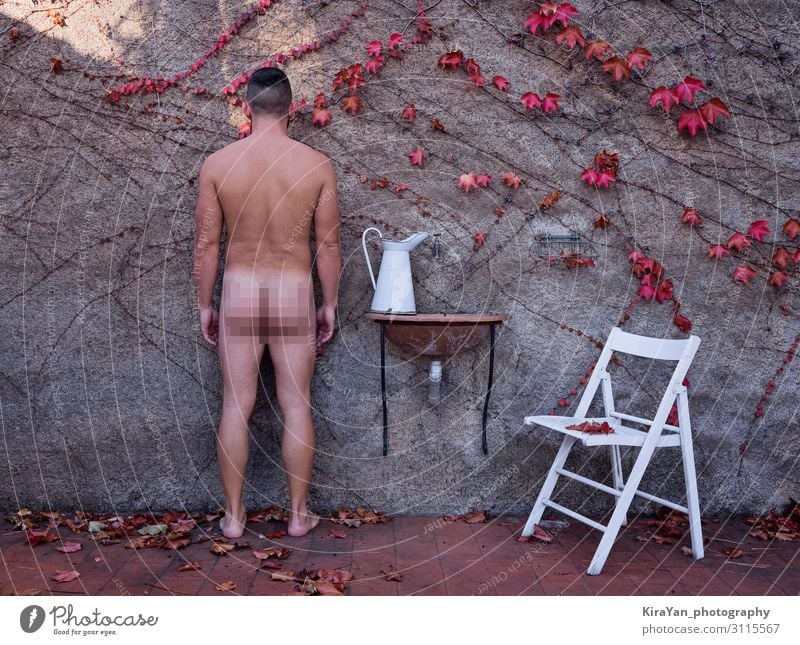 Adult naked man in autumnal backyard with white jug and chair with censured frame. Deadpan style photography Lifestyle Beautiful Health care Chair Human being