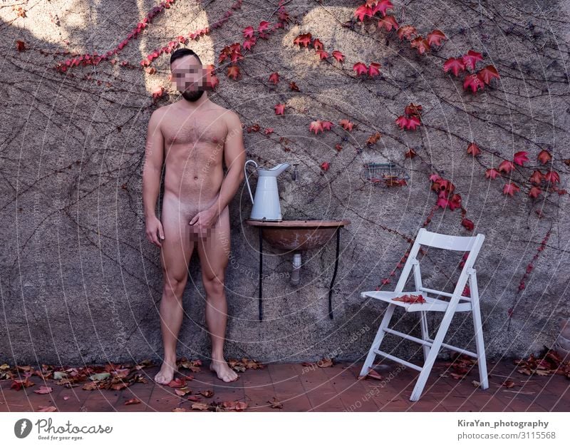 Adult naked man in autumnal backyard with white jug and chair with censured frame. Deadpan style photography Lifestyle Beautiful Health care Garden Masculine