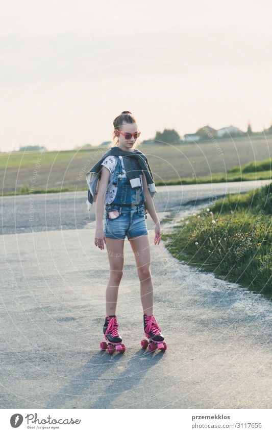 Young girl riding on roller skates Lifestyle Joy Happy Beautiful Relaxation Leisure and hobbies Playing Freedom Summer Summer vacation Ride Young woman