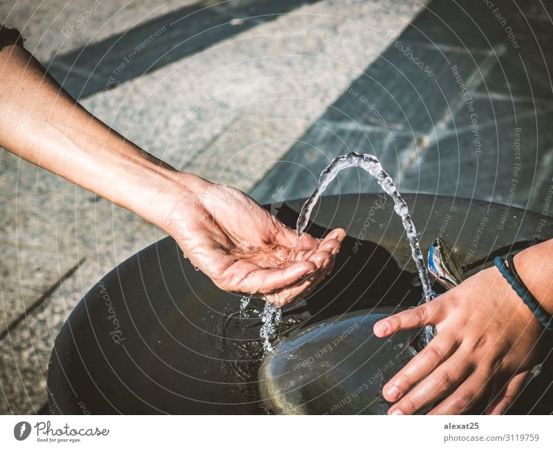 Water of a fountain pouring in woman hand Lifestyle Summer Human being Woman Adults Hand Fingers Nature Brook Drop Fresh Wet Natural Clean Colour Caucasian