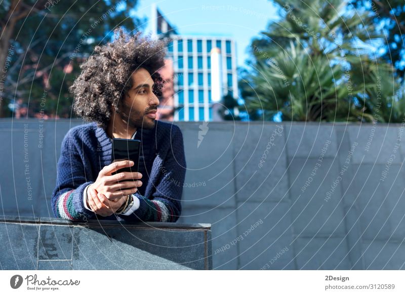Portrait of handsome afro man using his phone Lifestyle Style Happy Leisure and hobbies Telephone Cellphone Technology Human being Masculine Young man