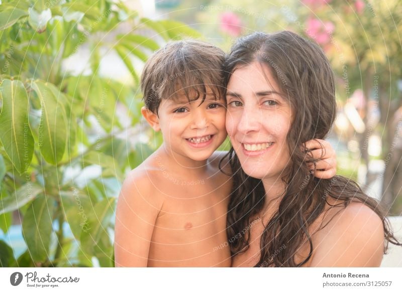 Smiling mother and son in swimming pool summer day Lifestyle Happy Swimming pool Summer Garden Mother's Day Human being Boy (child) Adults Family & Relations