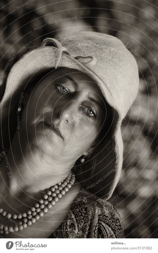 Boredom under a hat Woman Hat Necklace Earring Madame Earnest Elegant Weary Lady Looking into the camera Sepia lady's hat Pearl necklace Chain Adults bored