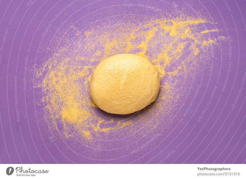 Cornbread dough with cornflour on a purple table Grain Dough Baked goods Vegetarian diet Healthy Eating Fresh Natural Yellow Gold Violet above view agriculture