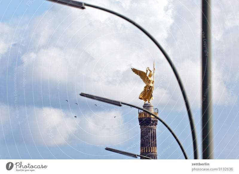 Victory column with lanterns and birds Monument else Goldelse victory statue Victoria big star Berlin zoo Park Forest Downtown Berlin Germany Figure leaf gold