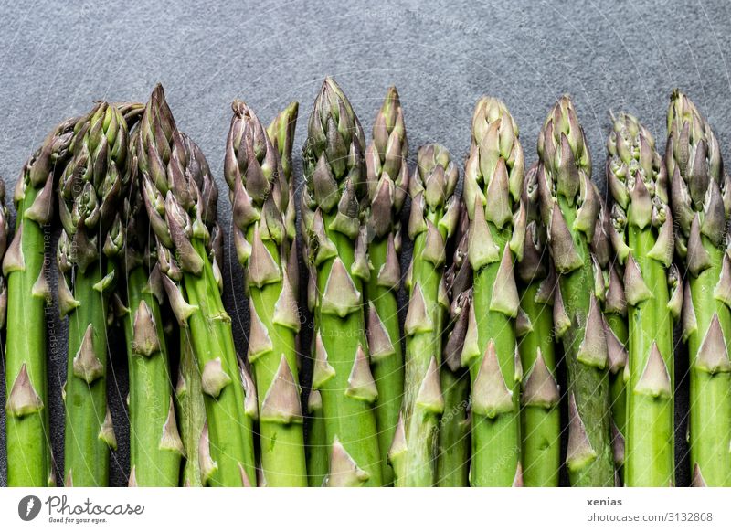 green asparagus on grey worktop Asparagus Green Food asparagus spears Vegetable Nutrition Organic produce Vegetarian diet Diet Spring Fresh Healthy Long