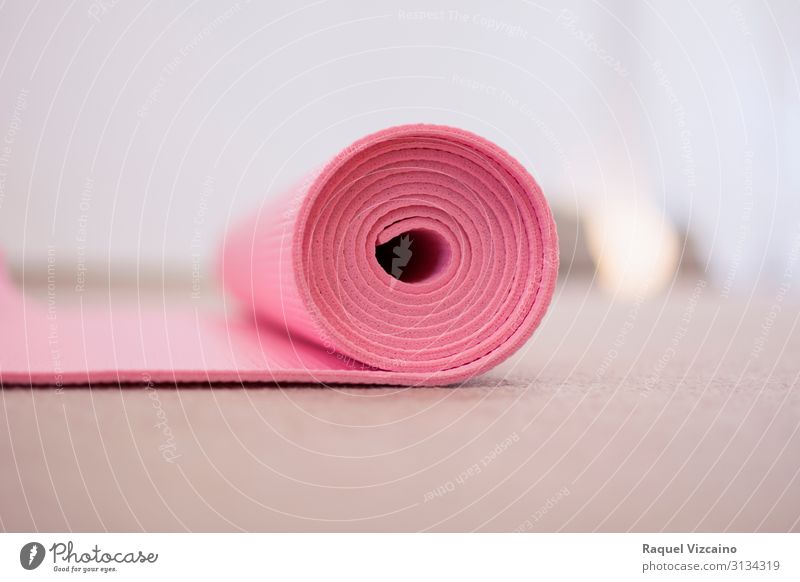 Pink yoga mat, rolled up. Lifestyle Wellness Sports Yoga Cloth White Peaceful Self Control Colour Contentment "pink isolated equipment colorful sport object
