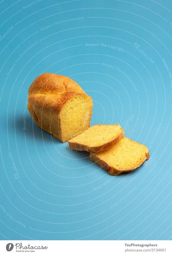 Corn bread and slices. Freshly baked bread with corn flour Bread Healthy Eating Table Delicious Blue Yellow Gold Portuguese bakery goods Baking Blue background