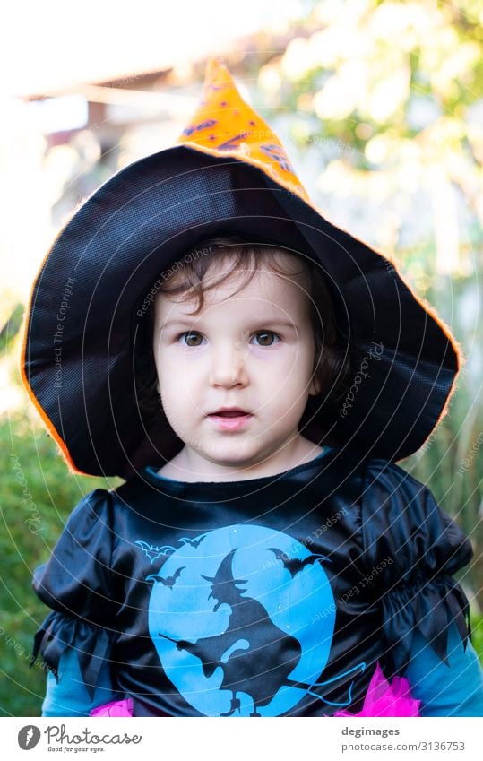 A little girl with a Halloween costume. Joy Happy Feasts & Celebrations Hallowe'en Child Infancy Autumn Dress Hat Dark Small Black Horror Tradition Witch