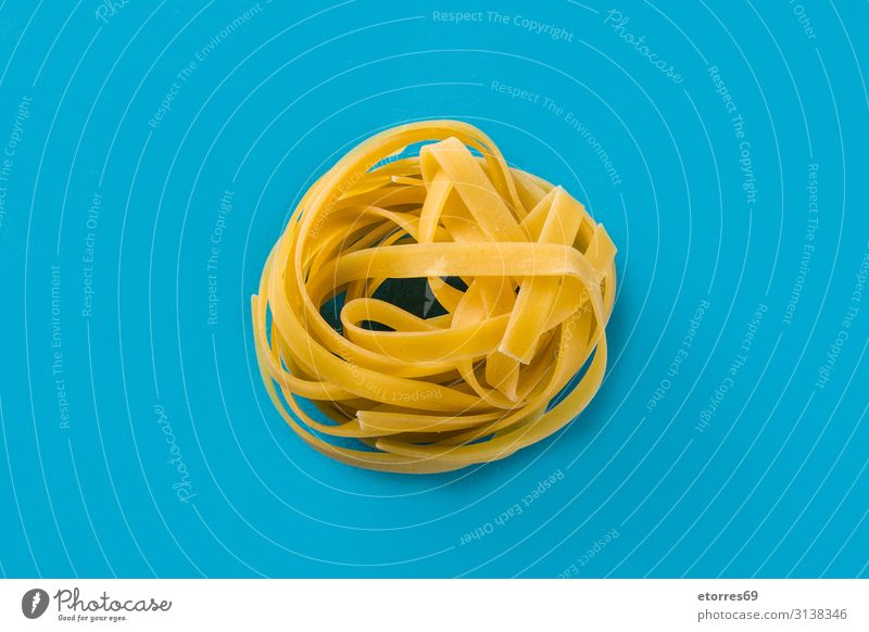 Capellini pasta on blue background capellini Fresh Italian Food Healthy Eating Food photograph Raw Tradition Tasty Blue Vegetable Gastronomy Cooking Dough flor