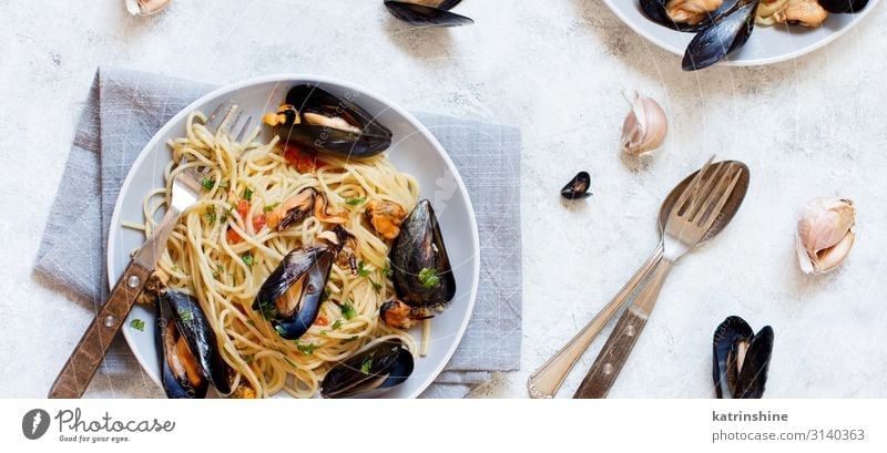 Spaghetti with mussels and tomatoes Seafood Lunch Plate Fork Spoon Restaurant Mussel Fresh Delicious pasta Italian Tomato negative space Copy Space Cooking
