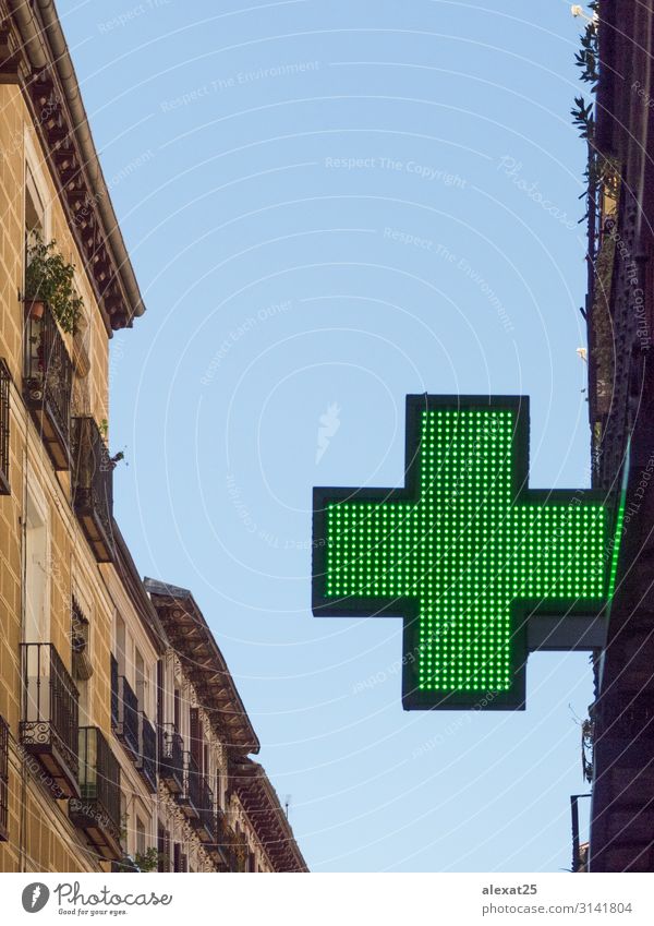Green cross in a building Shopping Design Medical treatment Medication Doctor Street aid care Copy Space cure Drugstore Emergency equipment health help Icon