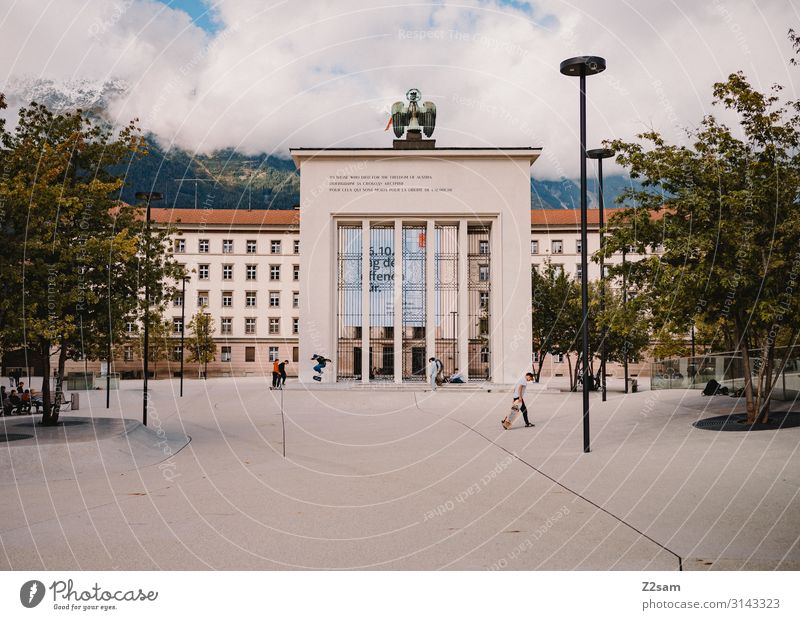Landhausplatz Innsbruck Lifestyle Leisure and hobbies Skateboarding Human being Youth (Young adults) Group Sky Clouds Beautiful weather Tree Bushes Alps