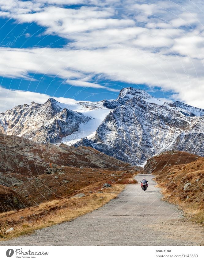 Motorcycle bike on mountain road in the Alps Lifestyle Vacation & Travel Tourism Trip Adventure Freedom Winter Snow Mountain Sports Engines Human being Man