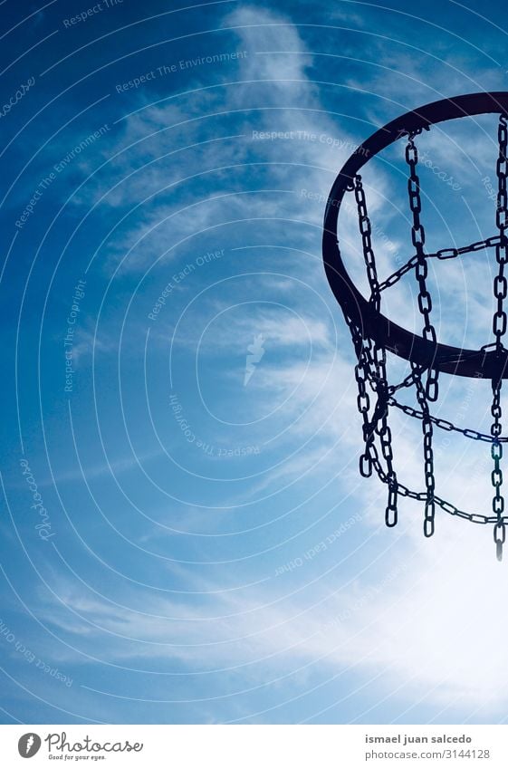 basketball hoop and blue sky Basketball Sky Blue Circle Iron chain Net Sports Sports equipment Playing Old Street Park Playground Exterior shot Minimal
