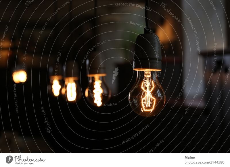Classic electric incandescent lamp Electric Electric bulb Background picture Black Bright Lamp Concepts &  Topics Concert Creativity Design Electricity Energy