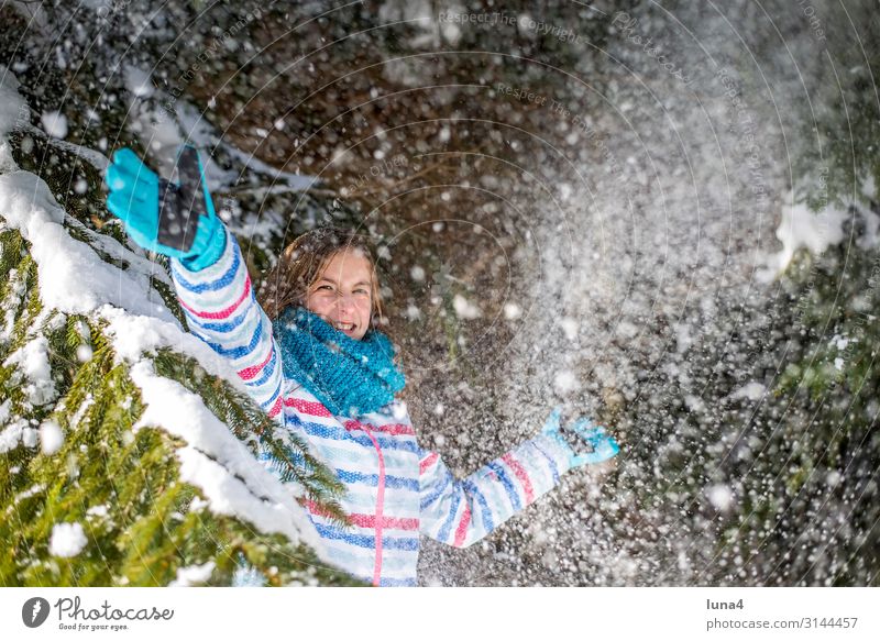 happy girl playing in the snow Joy luck Contentment Leisure and hobbies Playing Vacation & Travel Sun Winter Snow Child Landscape Weather Snowfall tree Forest