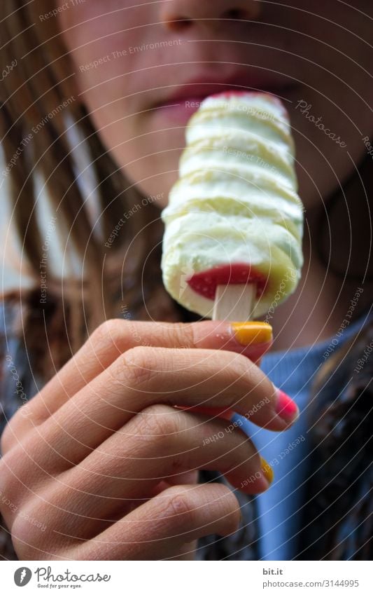 Girl with colorful painted fingernails, holding an ice cream in her hand in front of her mouth. Food Dessert Ice cream Nutrition Eating Picnic Vacation & Travel