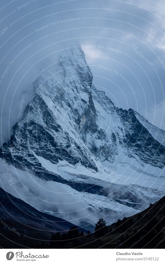 Matterhorn Covered In Clouds At Dusk Nature Landscape Earth Summer Winter Climate change Fog Ice Frost Snow Snowfall Mountain Glacier Freeze Vacation & Travel