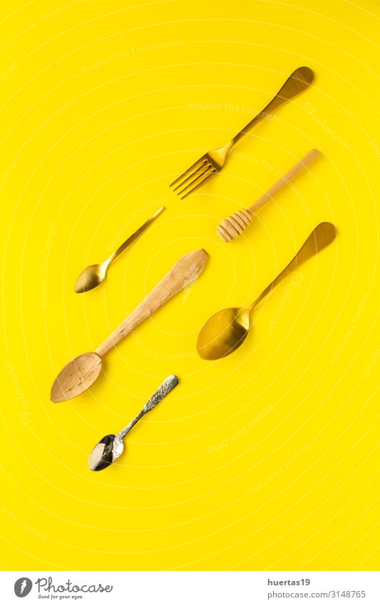 Spoons and forks on yellow background Breakfast Lunch Fork Elegant Design Kitchen Tool Group Collection Metal Yellow Colour knolling flat lay food Set utensil
