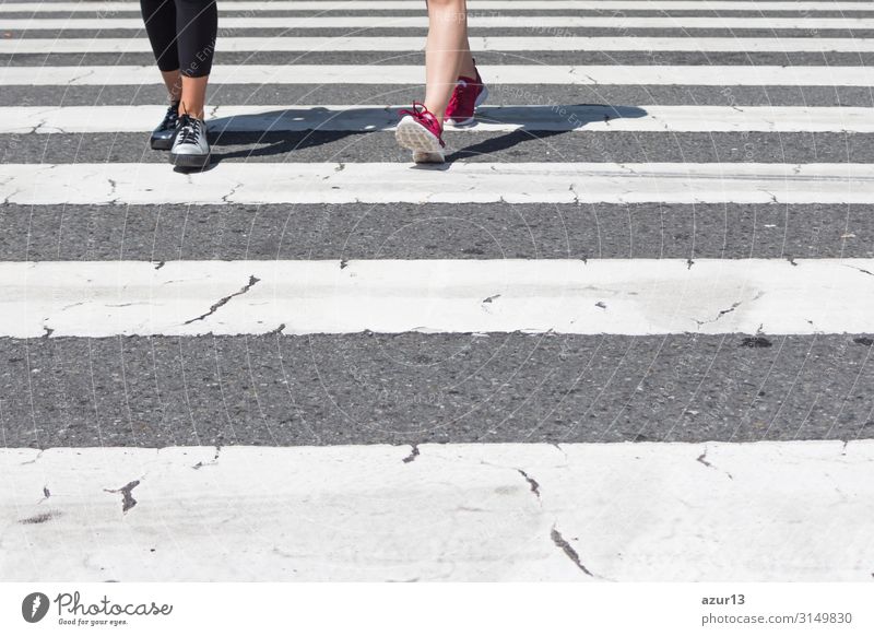 Pedestrian crossing city downtown girls walk in motion on road Lifestyle Shopping Sports Jogging Human being Woman Adults Downtown Stripe Symmetry Team Teamwork