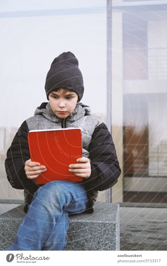 Boy with Tablet Computer Lifestyle Leisure and hobbies Playing Winter Study Schoolyard Schoolchild Notebook Technology Entertainment electronics