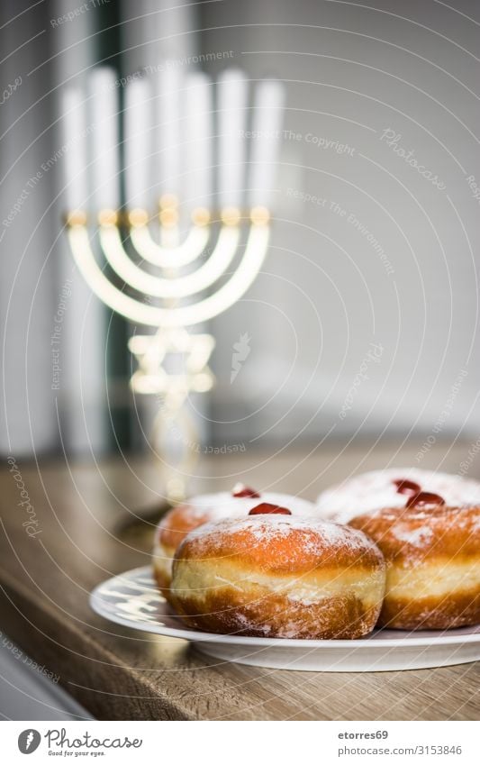 Jewish Hanukkah menorah and sufganiyot donuts hanukkah Menorah-im Candle Illuminate Feasts & Celebrations Israeli Gold Candelabra Culture david December