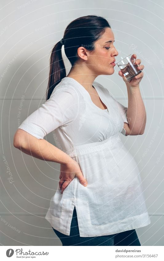 Pregnant drinking water Drinking Lifestyle Beautiful Relaxation Human being Baby Woman Adults Parents Mother Family & Relations Stand Authentic White