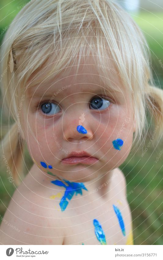 It wasn't me. Human being Feminine Child Toddler girl luck Positive Painted Carnival Finger paint portrait Half-profile Forward Looking away Infancy Happiness