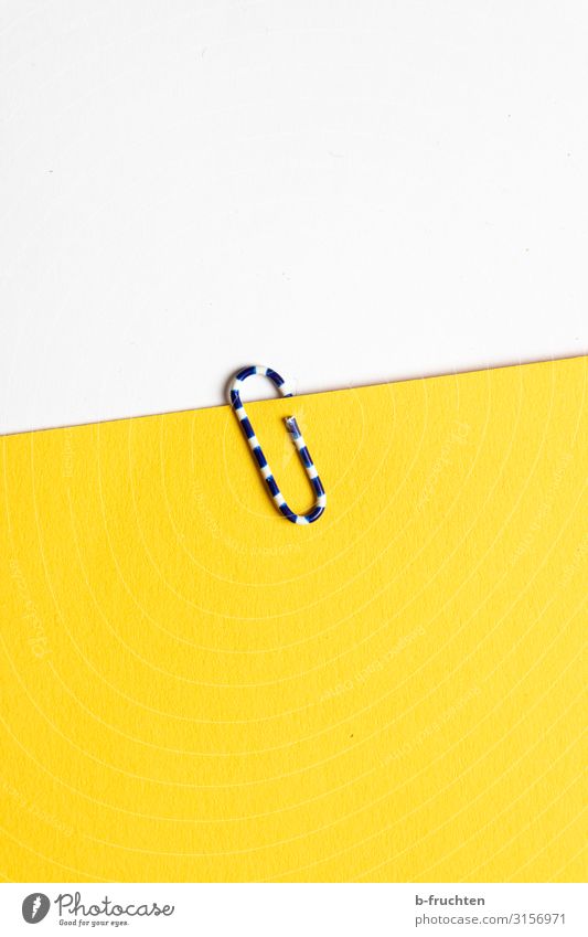 I'm clinging to you. Office work Workplace Business Stationery Paper Piece of paper Sign Work and employment Select Yellow White Paper clip To hold on Retentive