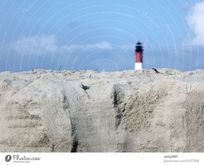 a lighthouse hides behind a lot of sand... Sand Lighthouse Tear-off edge Beach hörnum Sylt dune Blue sky Beautiful weather timid Vacation & Travel Sky Coast