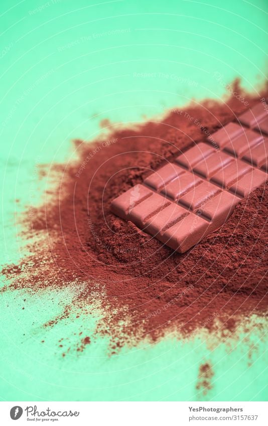 Cocoa powder pile and a milk chocolate bar Dessert Candy Chocolate Brown Tradition Christmas cooking background cacao powder Bar of chocolate chocolate chunk