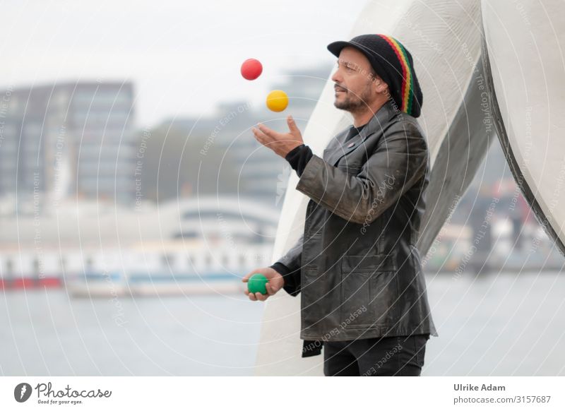 Artist juggles Juggle Juggler Ball Human being Masculine Man Adults Male senior 1 45 - 60 years street performer Hamburg Germany Town Port City Skyline Jacket