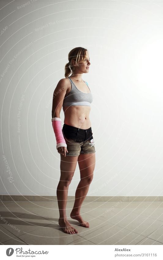 Young sportswoman with plastered arm Lifestyle Style Beautiful Athletic Fitness Sportsperson Young woman Youth (Young adults) low in gypsum Wound 18 - 30 years